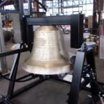 1,300 lb. restored bell with tolling striker