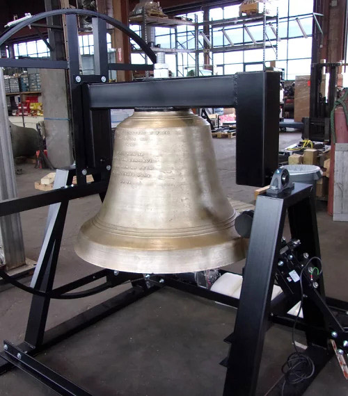 1,300 lb. restored bell with tolling striker